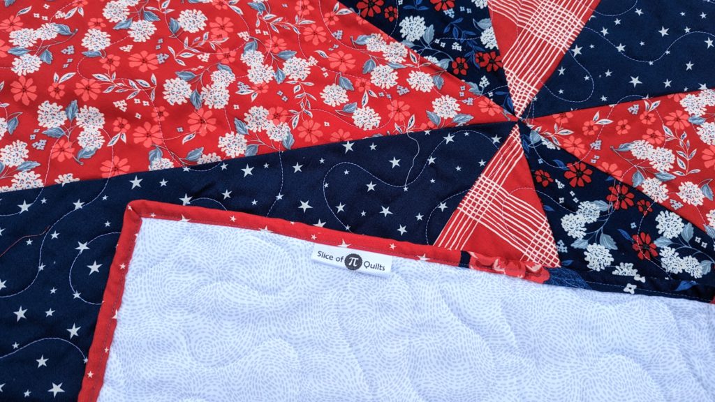Close up of red, white, and blue giant star quilt made with the Land of the Brave fabric collection