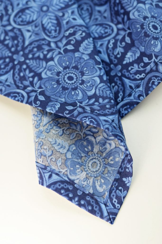 a quilted cotton napkin in blue print