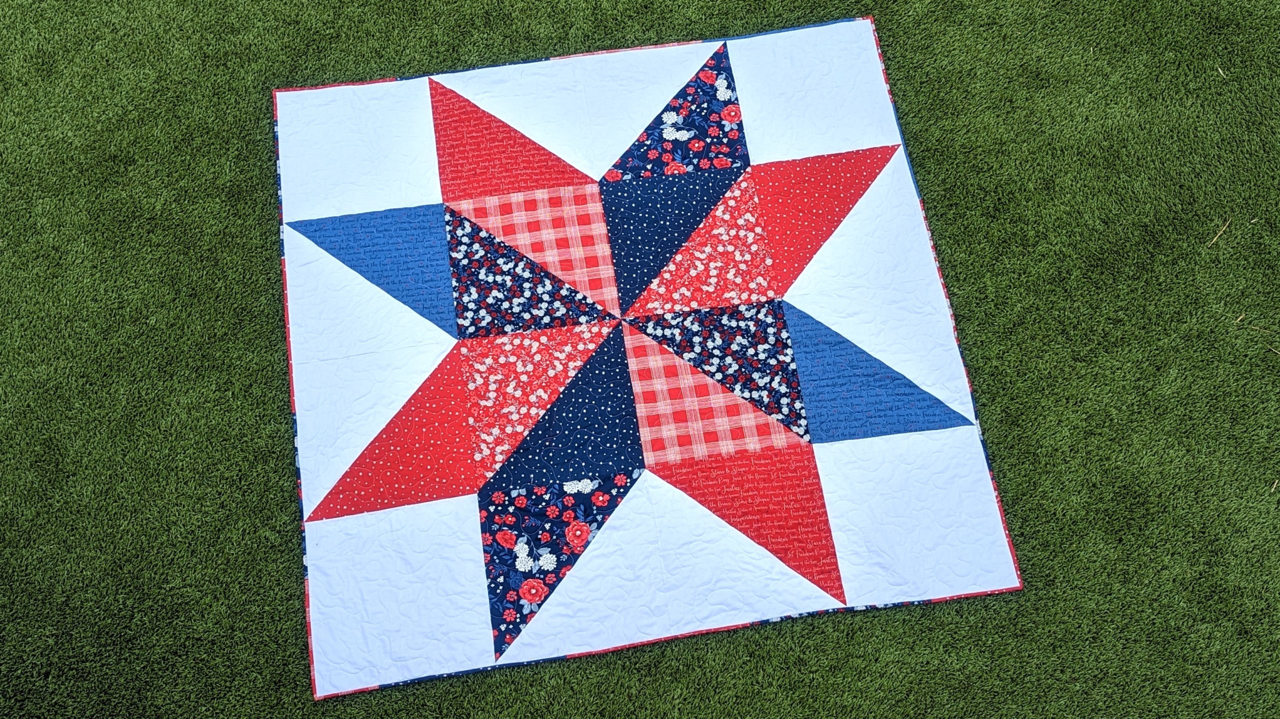 Red, white, and blue giant star quilt made with the Land of the Brave fabric collection