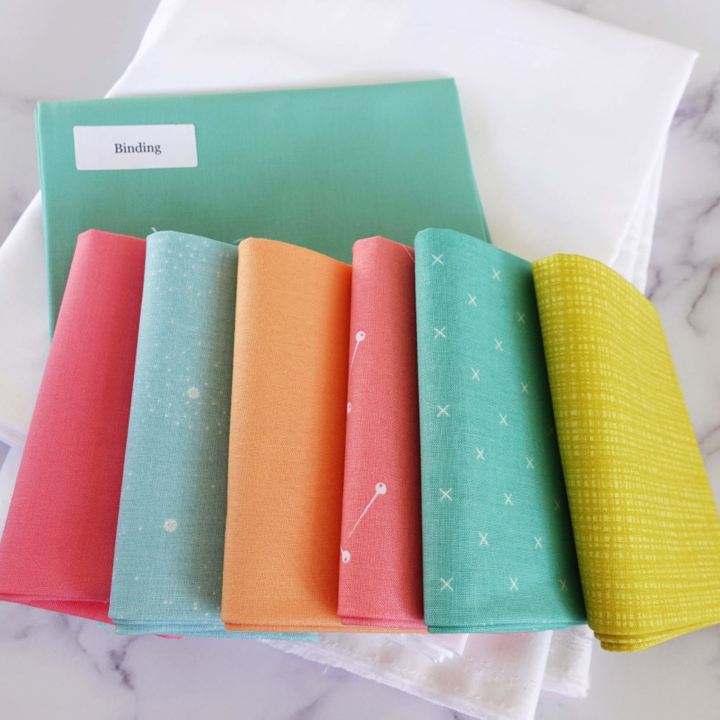 Brightly colored fabrics for the Jubilant Quilt Kit