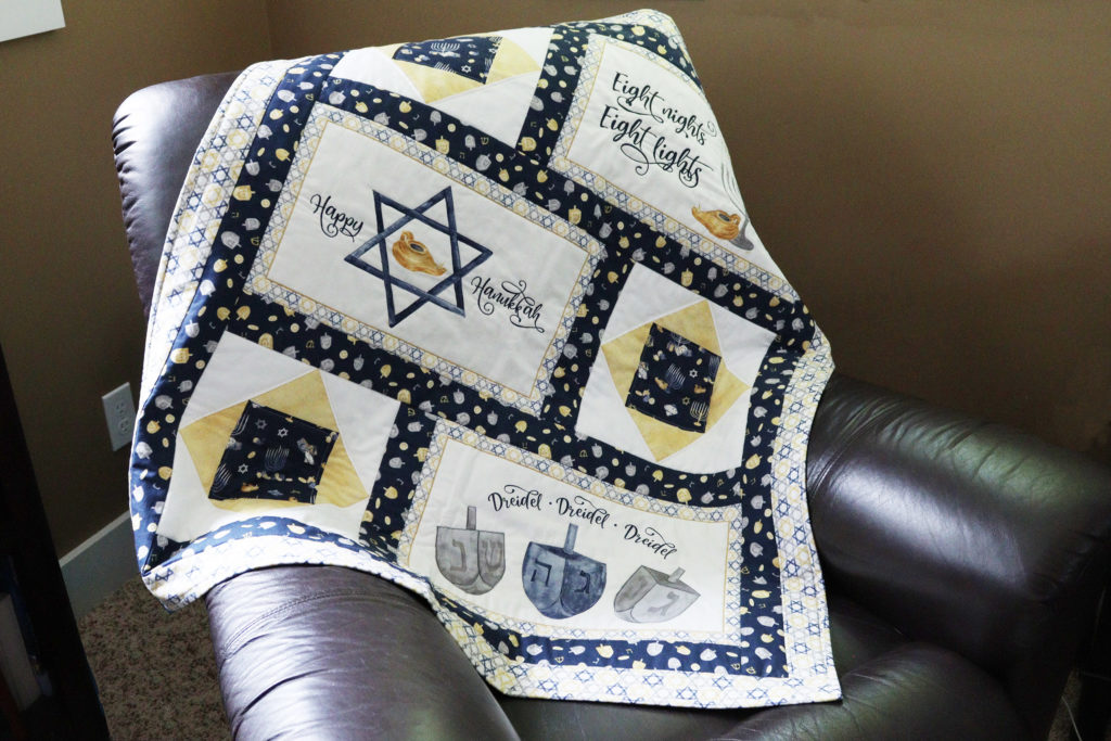 Hanukkah lap quilt made with Hanukkah Nights fabric and placemat panel by Tara Reed for Riley Blake Designs